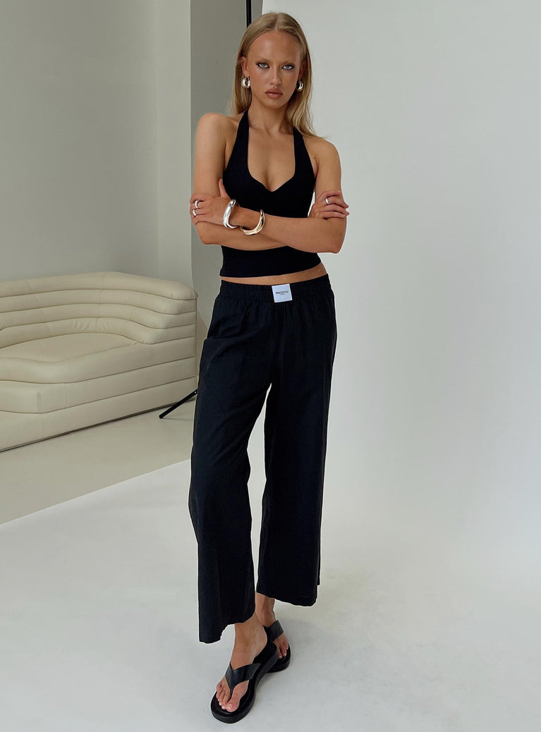 back view of model wearing Princess Polly Beach House Pants Black Low Rise Pants 