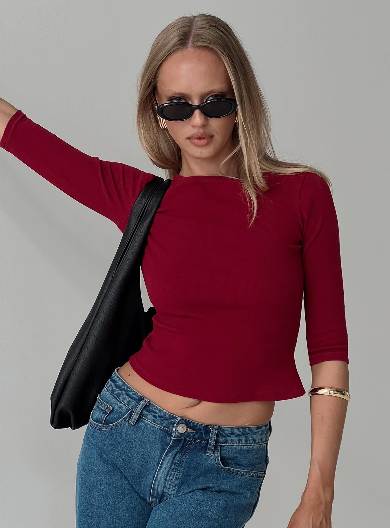 front view of model wearing Princess Polly Elaia 3/4 Sleeve Top Red Three Fourth Sleeves Crew Neck 