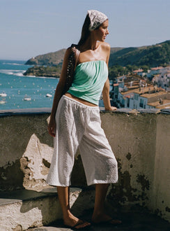 Discover the Kiss Me Quick 3/4 Lace Drawstring Pants in White featuring mid-rise womens-regular-pants side view of model wearing Princess Polly