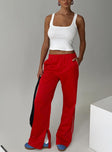 front view of model wearing Princess Polly Travalta Satin Track Pant Red Low Rise Pants 