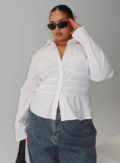 side view of model wearing Princess Polly Liesel Shirred Long Sleeve Top White Curve Full Sleeves V-Neck 