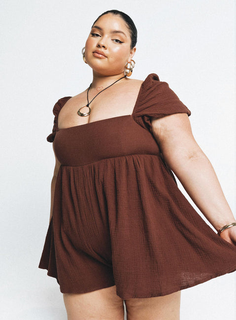 Romper Muslin material Square neckline  Elasticated puff sleeves Shirred back panel Invisible zip fastening at back  Relaxed leg 