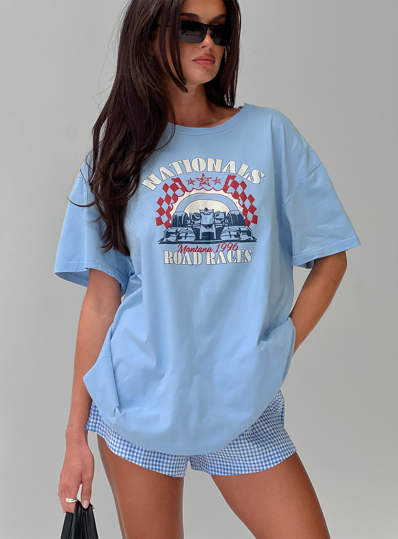 front view of model wearing Princess Polly Races 1996 Oversized Tee Blue Half Sleeves Crew Neck 