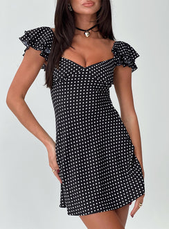 front view of model wearing Princess Polly Moretti Mini Dress Black Polka Dot Sweetheart Neckline 