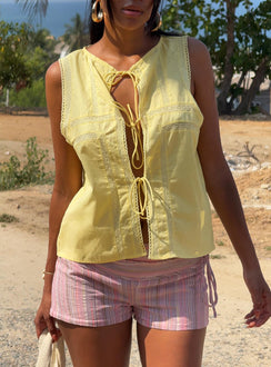 front view of model wearing Princess Polly Angourie Blouse Top Lemon Sleeveless Crew Neck 