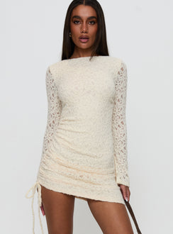side view of model wearing Princess Polly Que Sera Long Sleeve Mini Dress Cream Boat Neck 