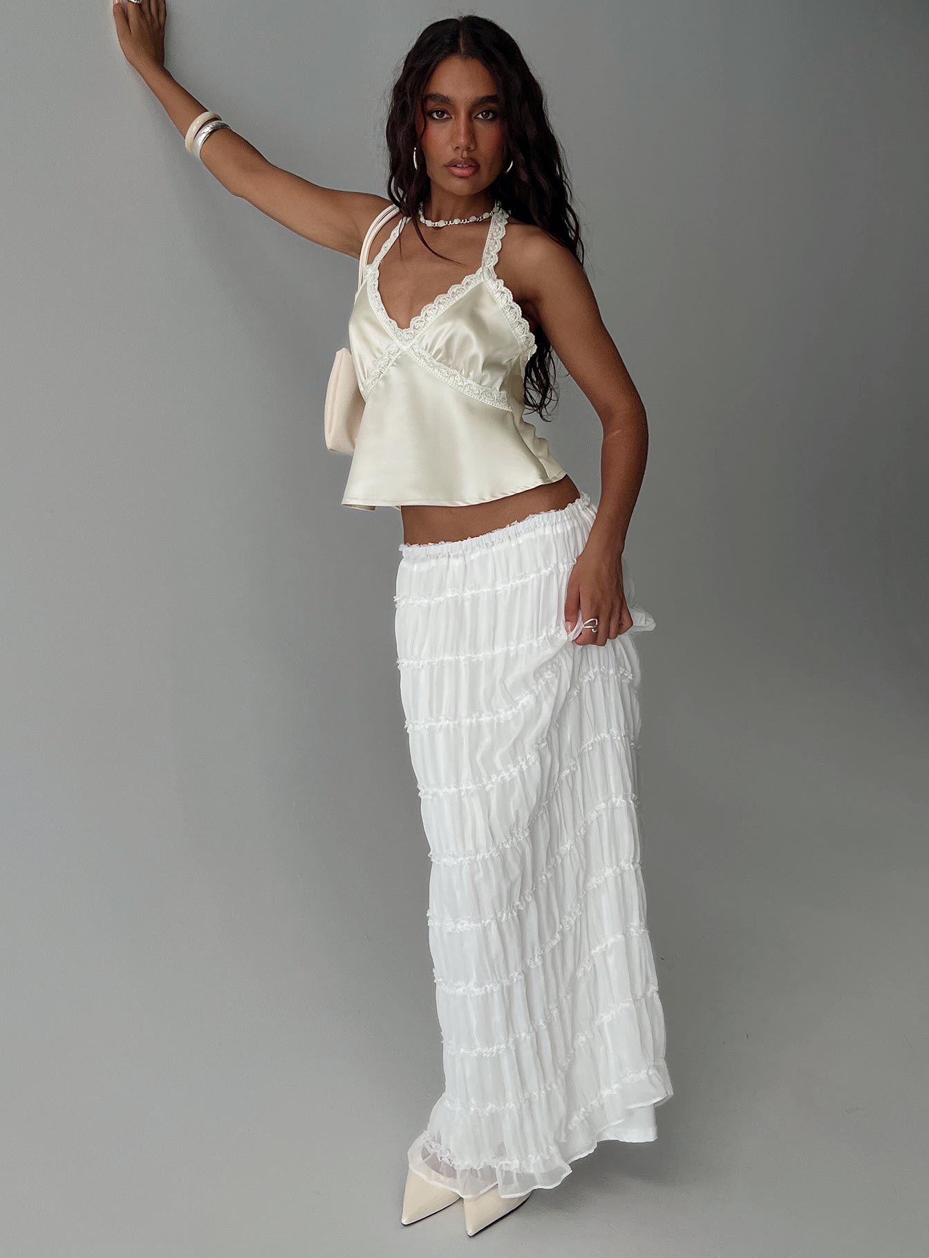   side view of model wearing Princess Polly Estefania Maxi Skirt White Maxi 