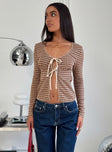 side view of model wearing Princess Polly Maemi Long Sleeve Tie Up Top Brown Check Full Sleeves Scoop Neck 