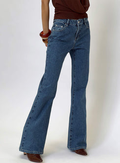 back view of model wearing Princess Polly Magic Mirror Mid Rise Bootleg Jeans Mid Blue Wash Mid Rise Jeans 