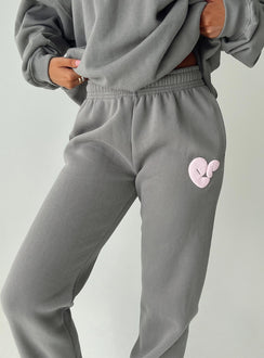 front view of model wearing Princess Polly Princess Polly Track Pants Bubble Text Charcoal / Light Pink Mid Rise 