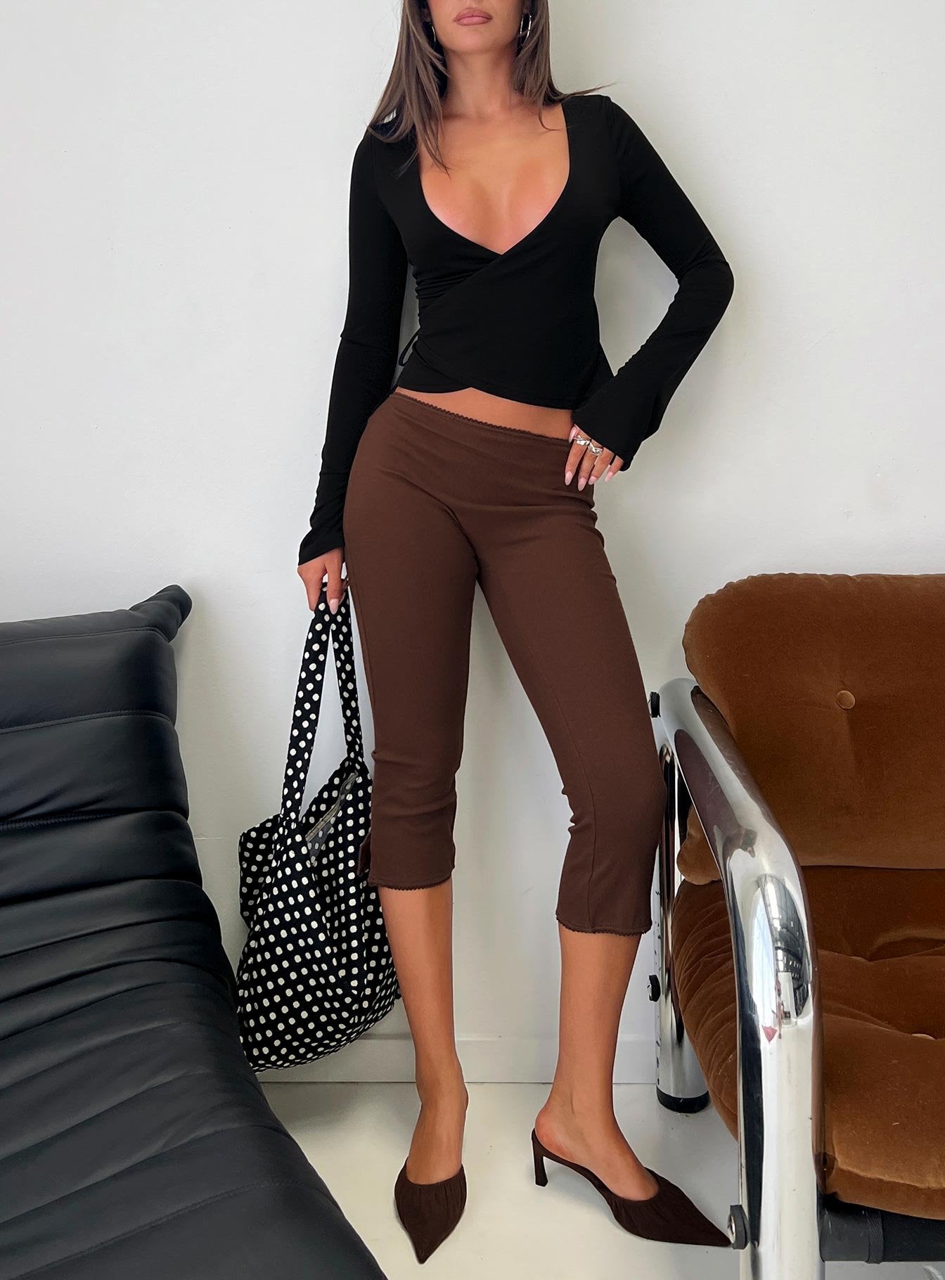 front view of model wearing Princess Polly Baseline Rib Capri Pants Chocolate Mid Rise Pants 