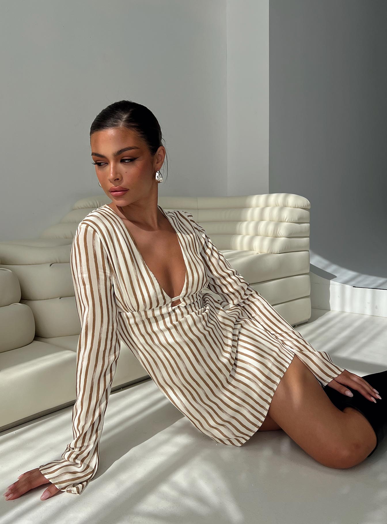 side view of model wearing Princess Polly The Good Life Mini Dress Brown / White Stripe Plunger 