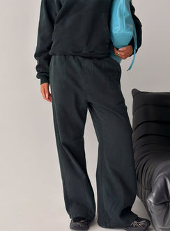 Crafted from black Baggy Sweatpant in womens regular pants with wide-leg mid-rise design front view of model wearing Princess Polly