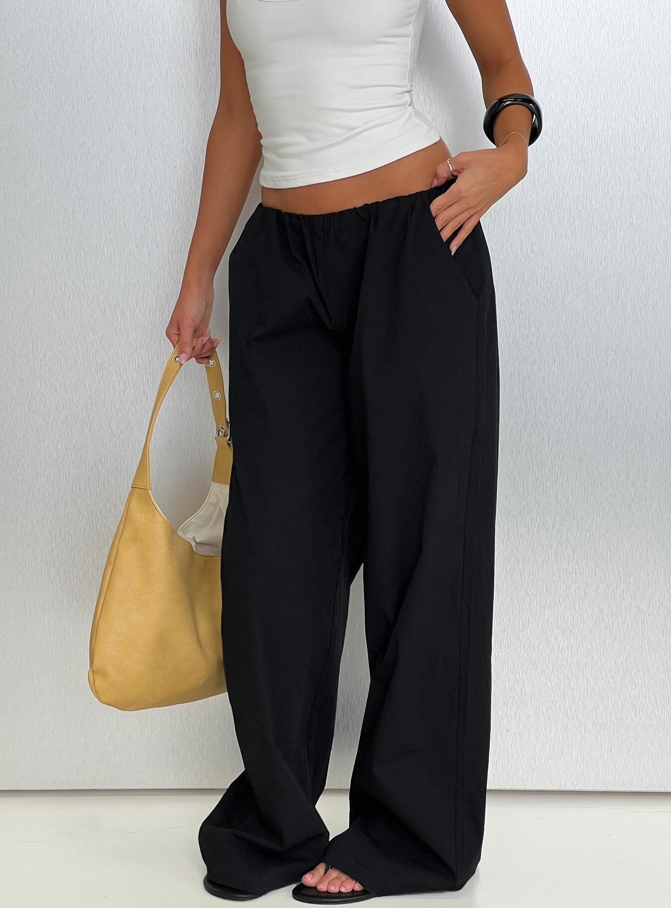 front view of model wearing Princess Polly Lunea Concealed Waistband Pants Black Low Rise Pants 