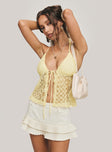 side view of model wearing Princess Polly CHANTRIA LACE TOP YELLOW Sleeveless Plunger 