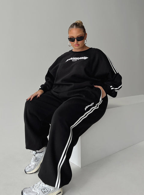 front view of model wearing Princess Polly Princess Polly Track Pants Stripe Black / White Curve High Waisted Pants 