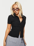 front view of model wearing Princess Polly Arnica Top Black Stripe Short Sleeves V-Neck 