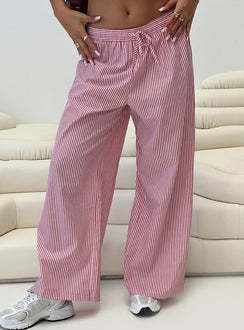 side view of model wearing Princess Polly Holiday Tie Front Pants Red/White Stripe Low Rise Pants 