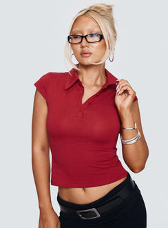 front view of model wearing Princess Polly Prodigy Collared Polo Top Red Short Sleeves V-Neck 