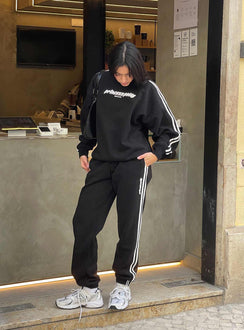 front view of model wearing Princess Polly Princess Polly Track Pants Stripe Black / White High Waisted Pants 