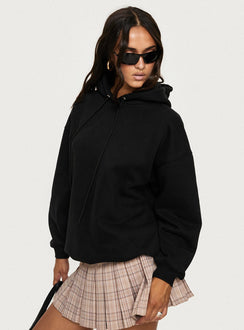 side view of model wearing Princess Polly Alvon Hooded Sweatshirt Black regular 