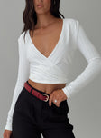 front view of model wearing Princess Polly Cushien Long Sleeve Top White Full Sleeves Plunger 