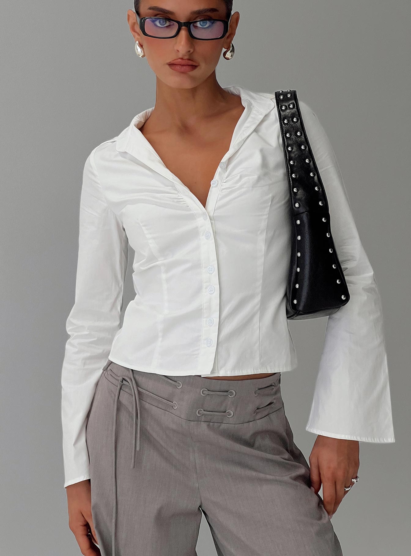 front view of model wearing Princess Polly Arianwyn Long Sleeve Shirt White Full Sleeves V-Neck 