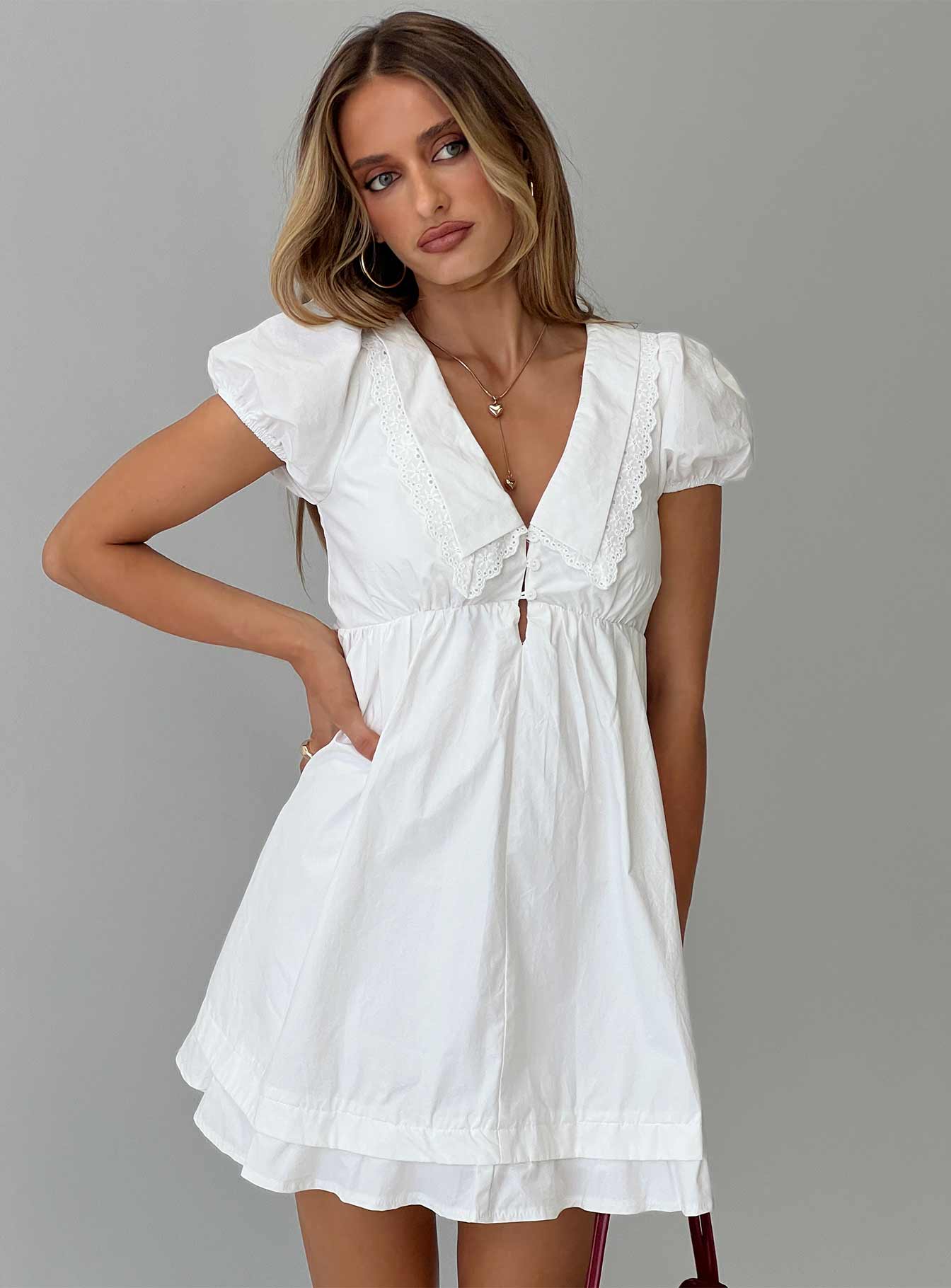 front view of model wearing Princess Polly Sailoh Puff Sleeve Baby Doll Mini Dress White V-Neck 