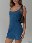 side view of model wearing Princess Polly Rautha Denim Mini Dress Mid Wash Tall Scoop Neck 