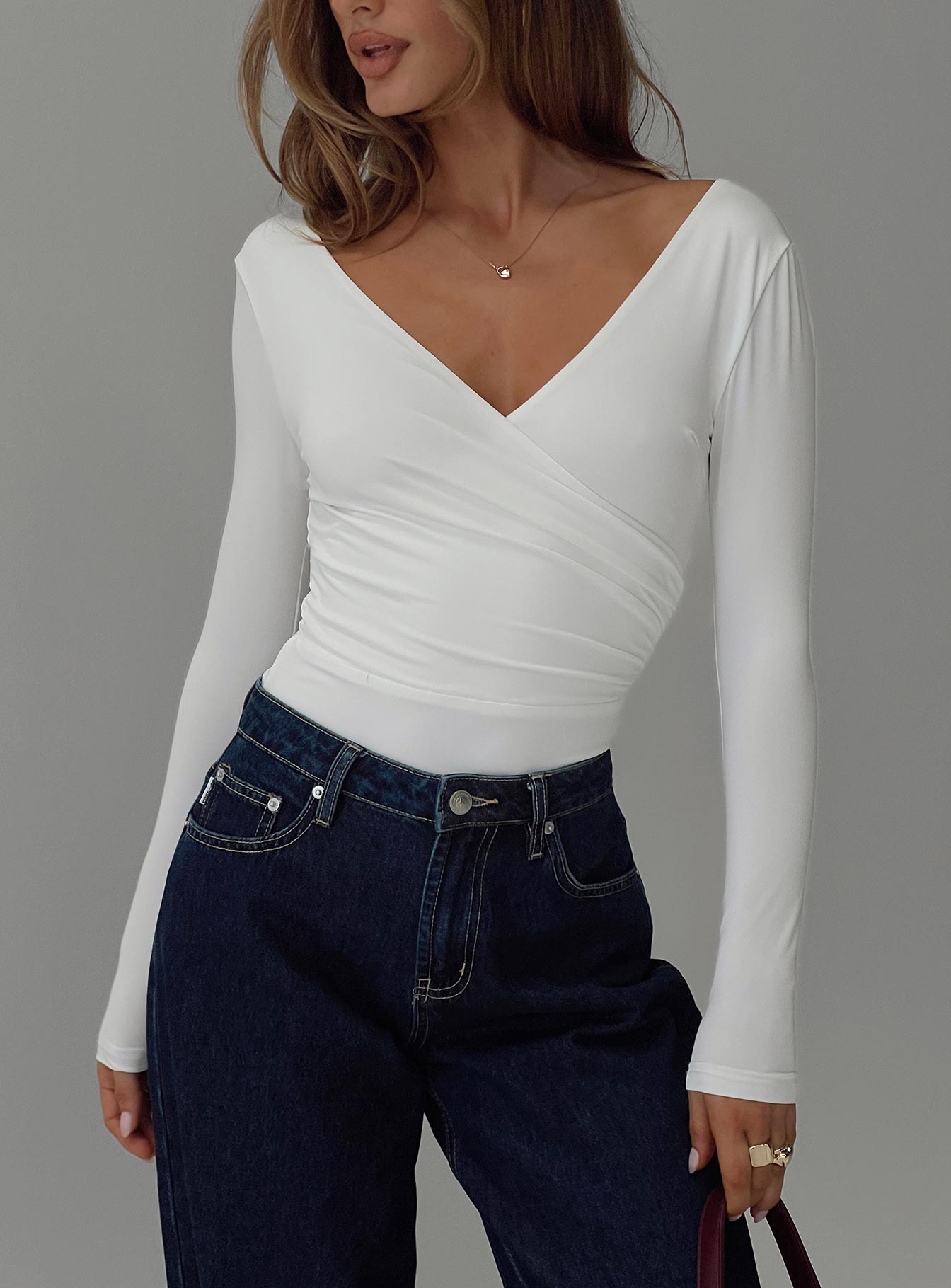 front view of model wearing Princess Polly Right Here Cross Detail Bodysuit White Long Sleeve Tops 