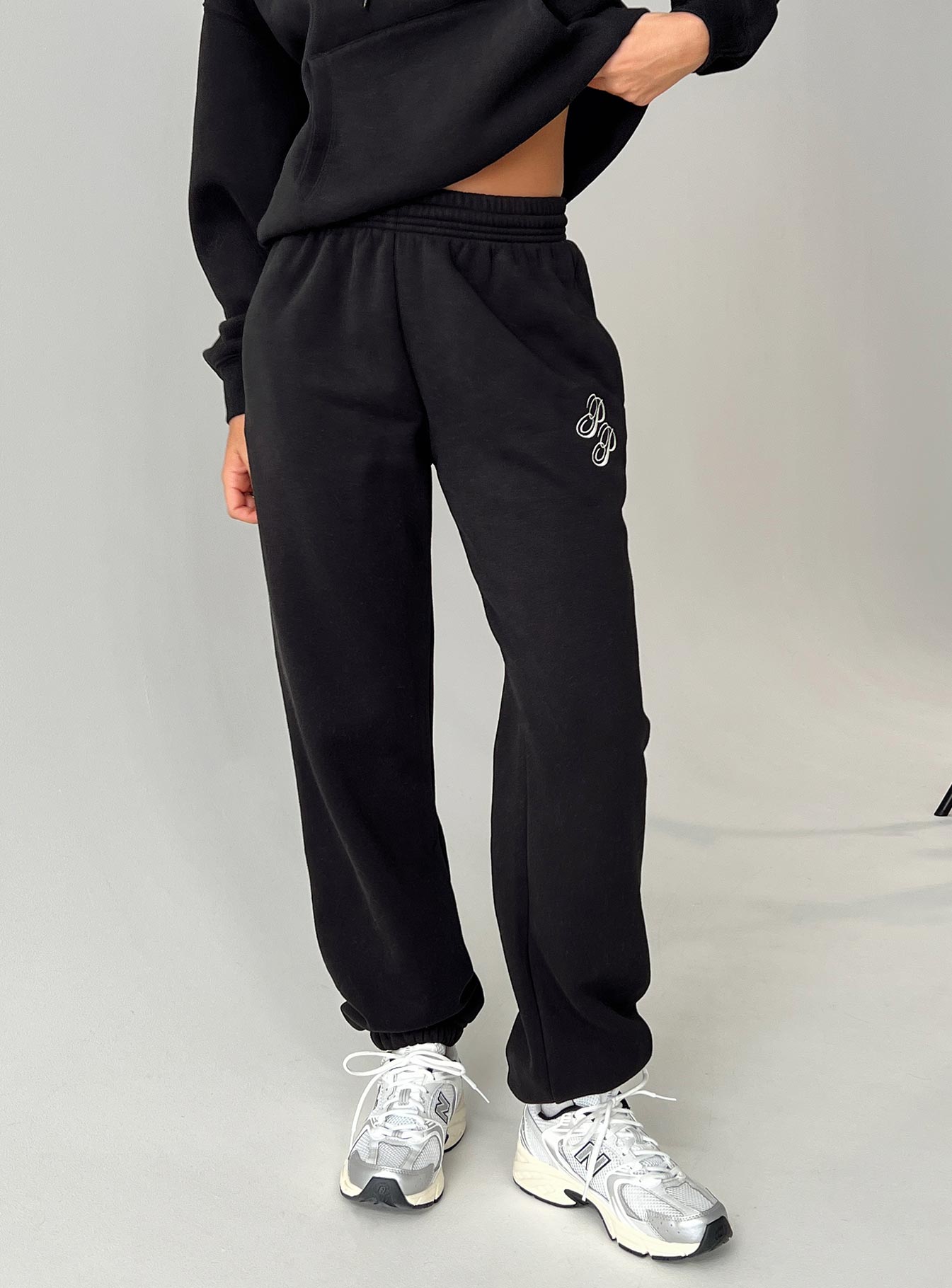 front view of model wearing Princess Polly Princess Polly Track Pants Script Black / Ivory High Waisted Pants 
