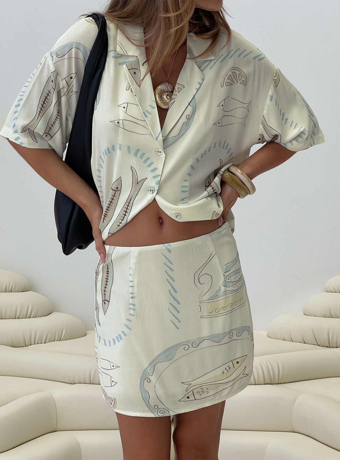 back view of model wearing Princess Polly Caraliia Mini Skirt Cream Mini Skirts 