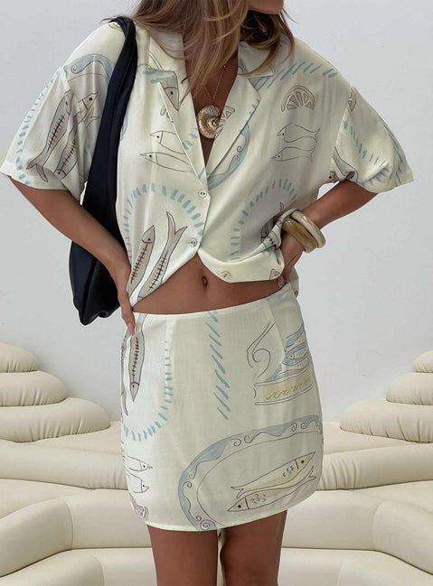 back view of model wearing Princess Polly Caraliia Mini Skirt Cream Mini Skirts 