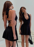 back view of model wearing Princess Polly Maeva Halter Mini Dress Black Tall Plunger 