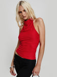 side view of model wearing Princess Polly Dafina Halter Top Red Sleeveless Cowl 