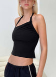 side view of model wearing Princess Polly Glint Asymmetrical Top Black Sleeveless Asymmetric Neckline 