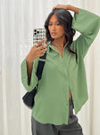 Front view of model wearing  front Princess Polly Full Sleeves V-Neck  Newcastle Shirt Green