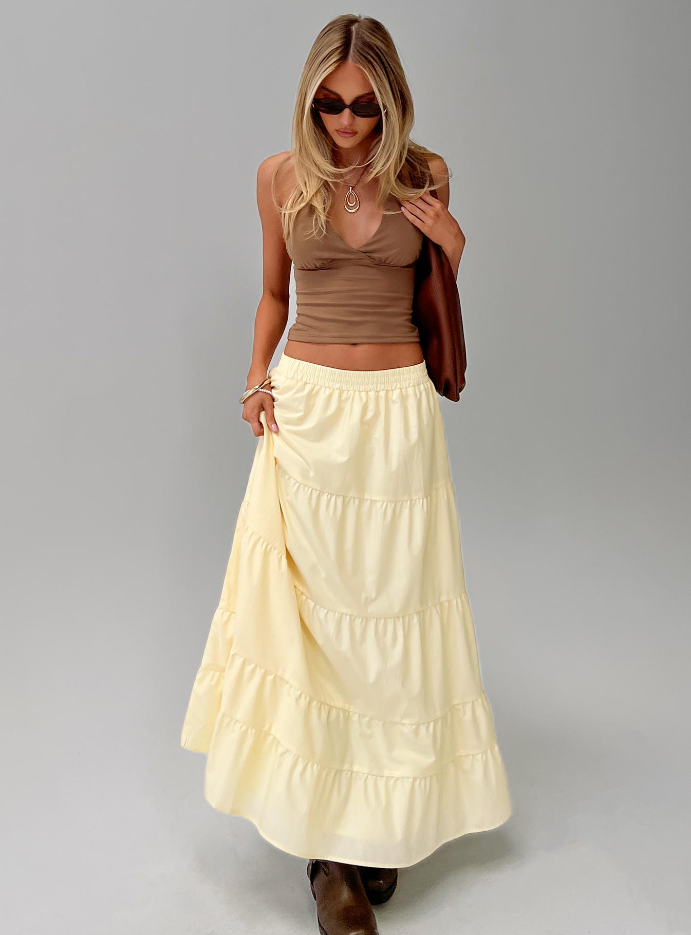   side view of model wearing Princess Polly Garden Party Maxi Skirt Lemon Maxi 