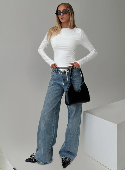 front view of model wearing Princess Polly Mellowed Out Slouchy Jeans Mid Blue High Waisted 