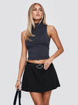   side view of model wearing Princess Polly Barrymore Mini Skort Black Mini Skirts 