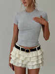 front view of model wearing Princess Polly Match Point Mini Skort Porcelain Low Rise Shorts 