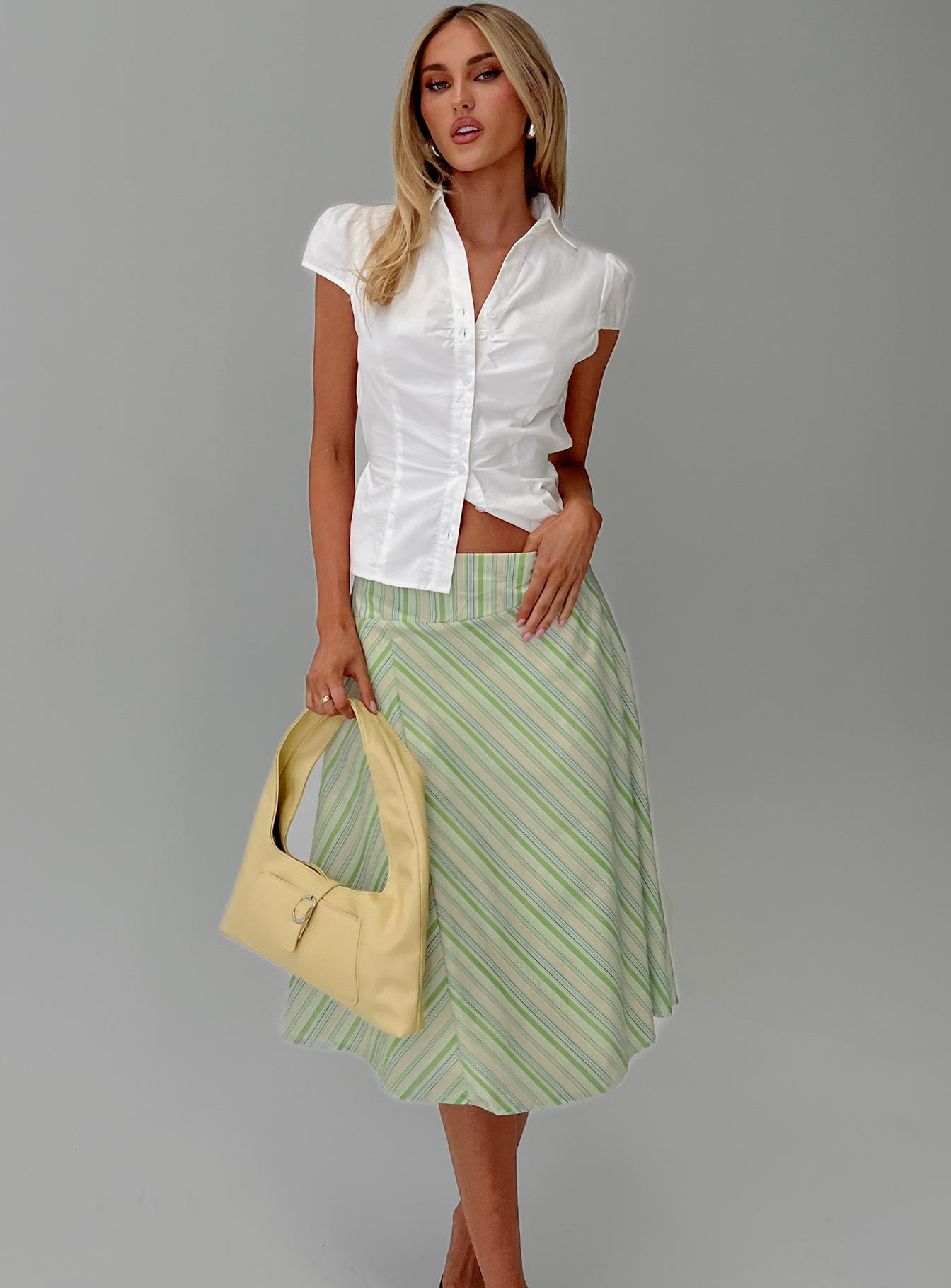   side view of model wearing Princess Polly Vettie Midi Skirt Green Multi Midi Skirts 