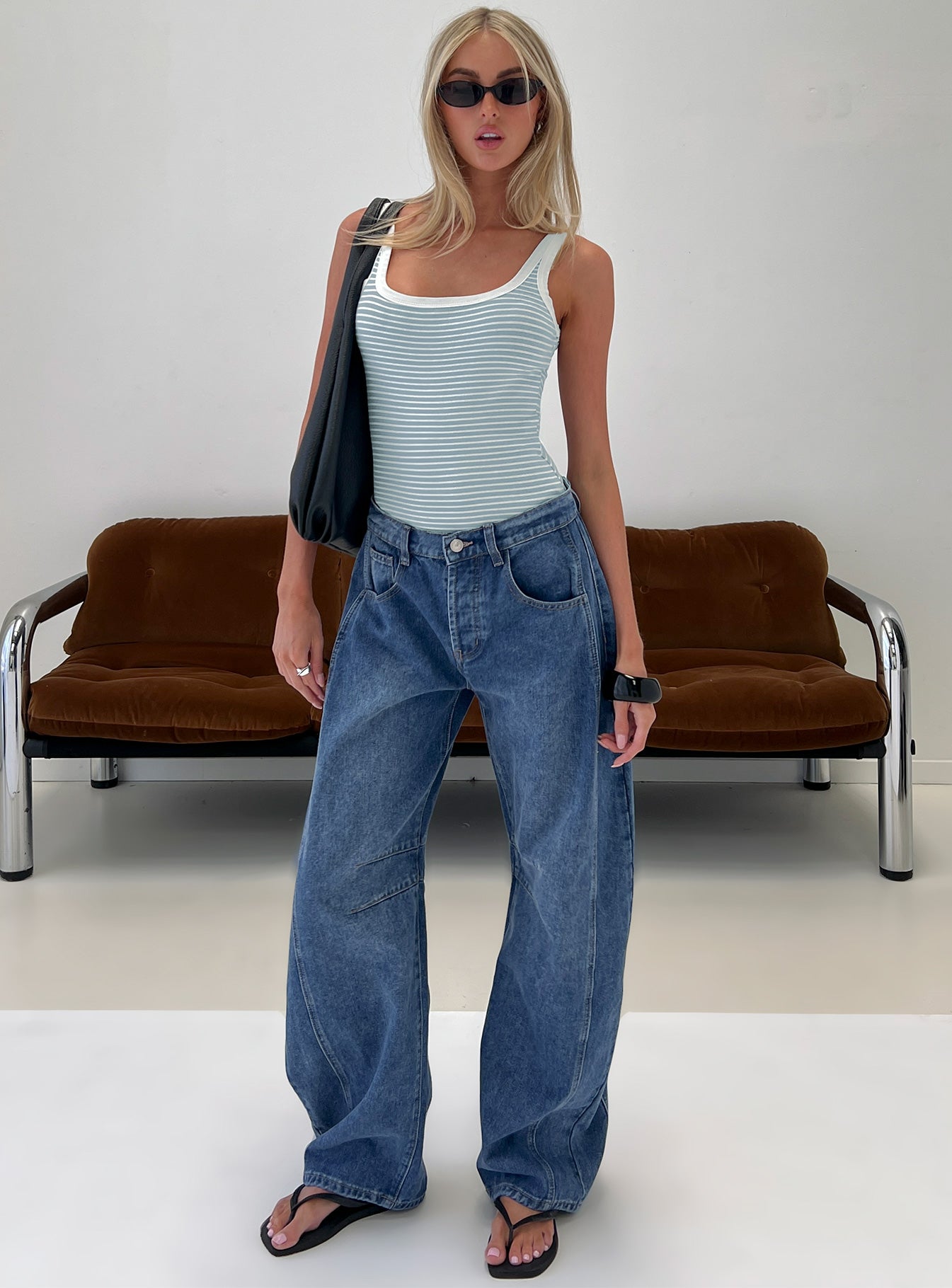 front view of model wearing Princess Polly Normana Mid Rise Cropped Barrel Jeans Mid Blue Wash Mid Rise Jeans 