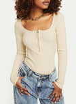 front view of model wearing Princess Polly Zuma Long Sleeve Bodysuit Beige Full Sleeves Scoop Neck 