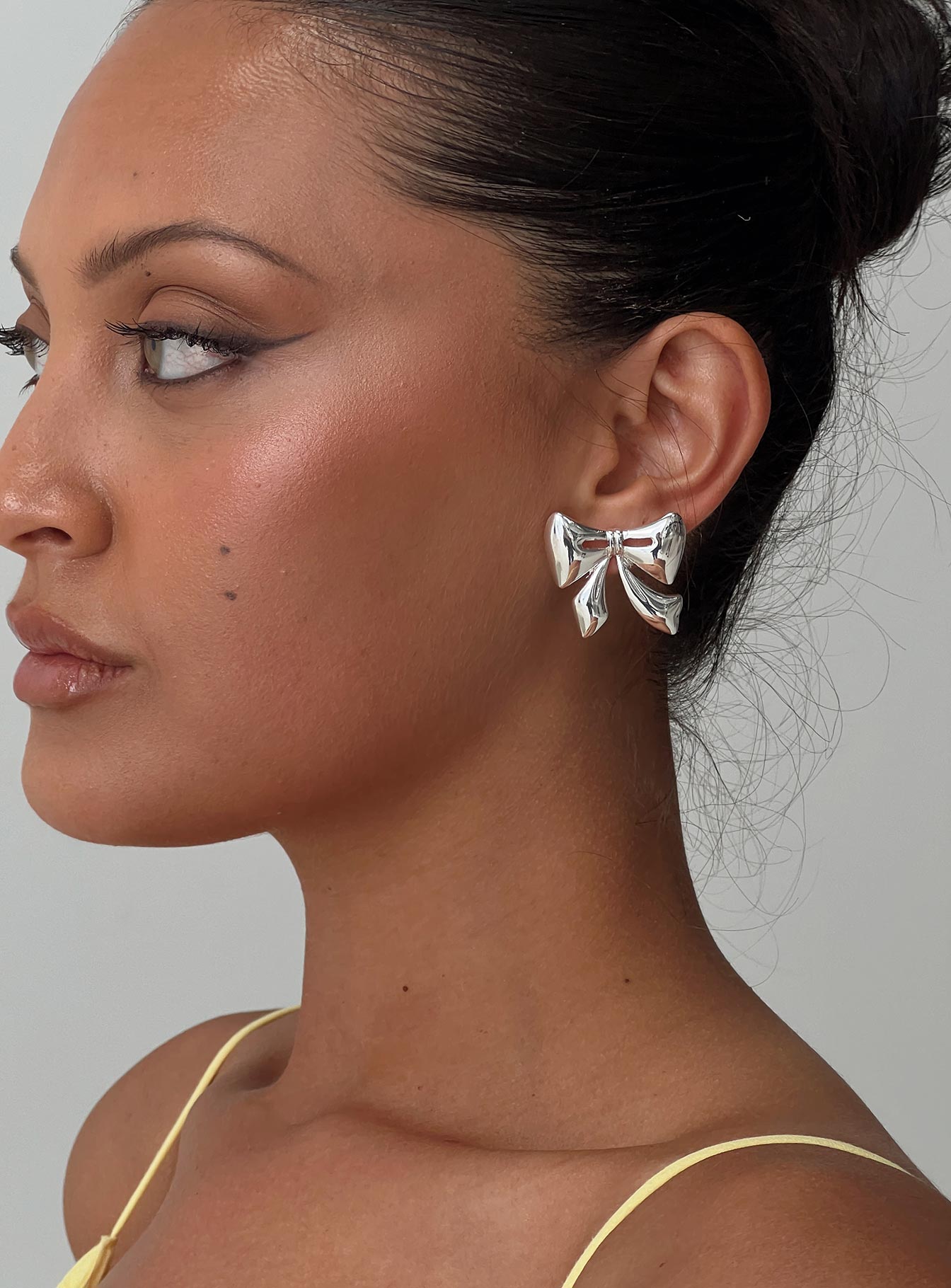 Make Believe Bow Earrings Silver