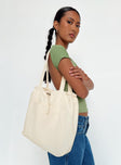 Tote bag Fixed shoulder straps, internal and external slip pockets, drawstring fastening