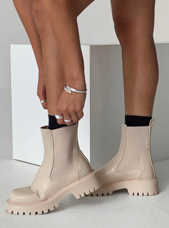 Faux leather boots Rounded toe, treaded sole, pull tab at back, passed footbed