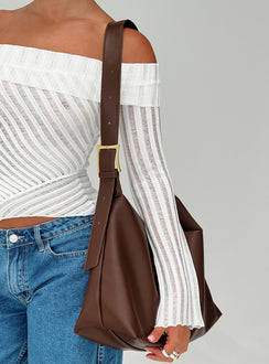 Faux leather bag  Adjustable shoulder strap, gold-toned buckle, single internal pocket with zip fastening, fully lined