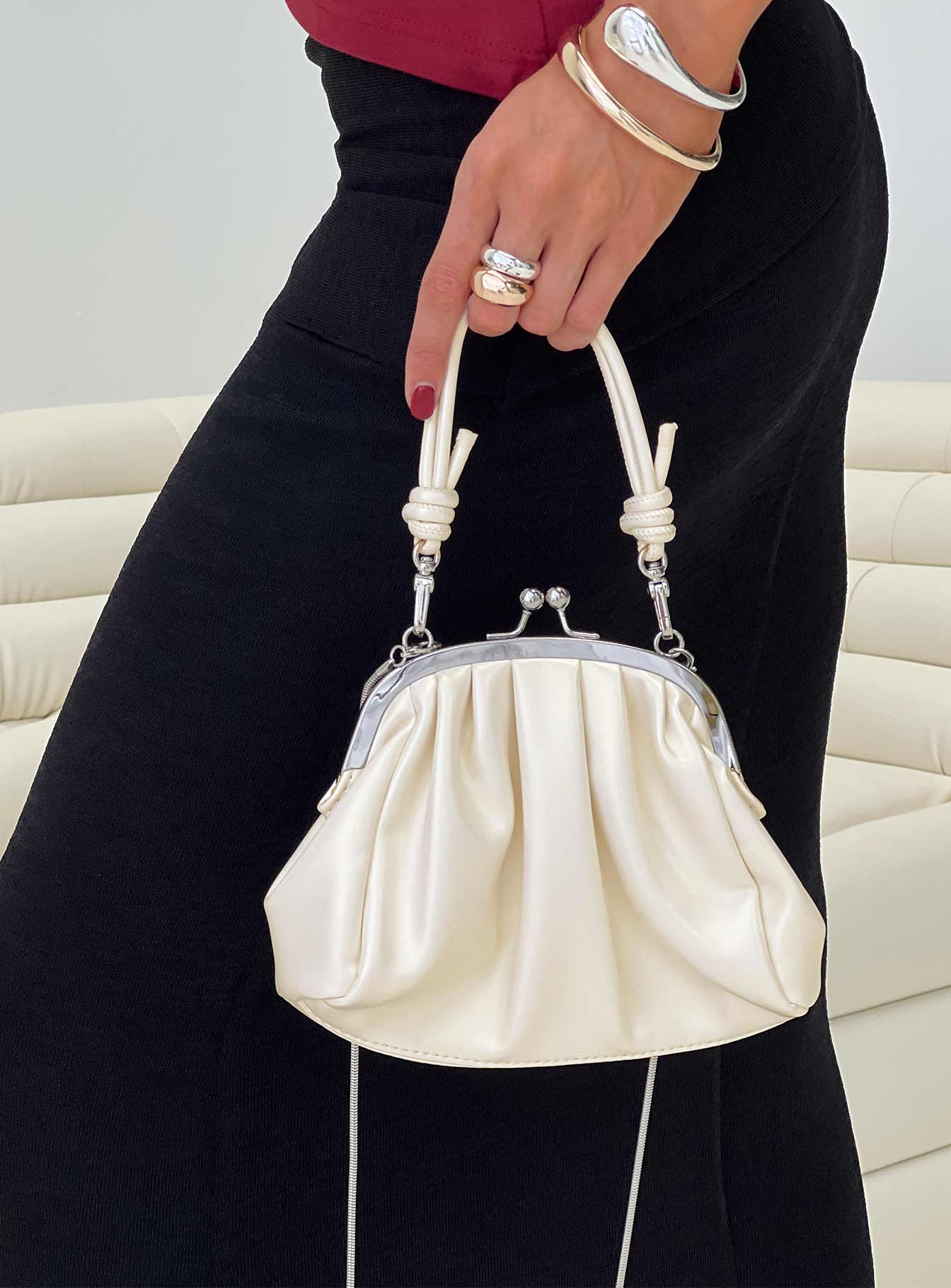 Clutch Silver-toned hardware, snap closure, fixed handle, removable crossbody strap, internal card slip