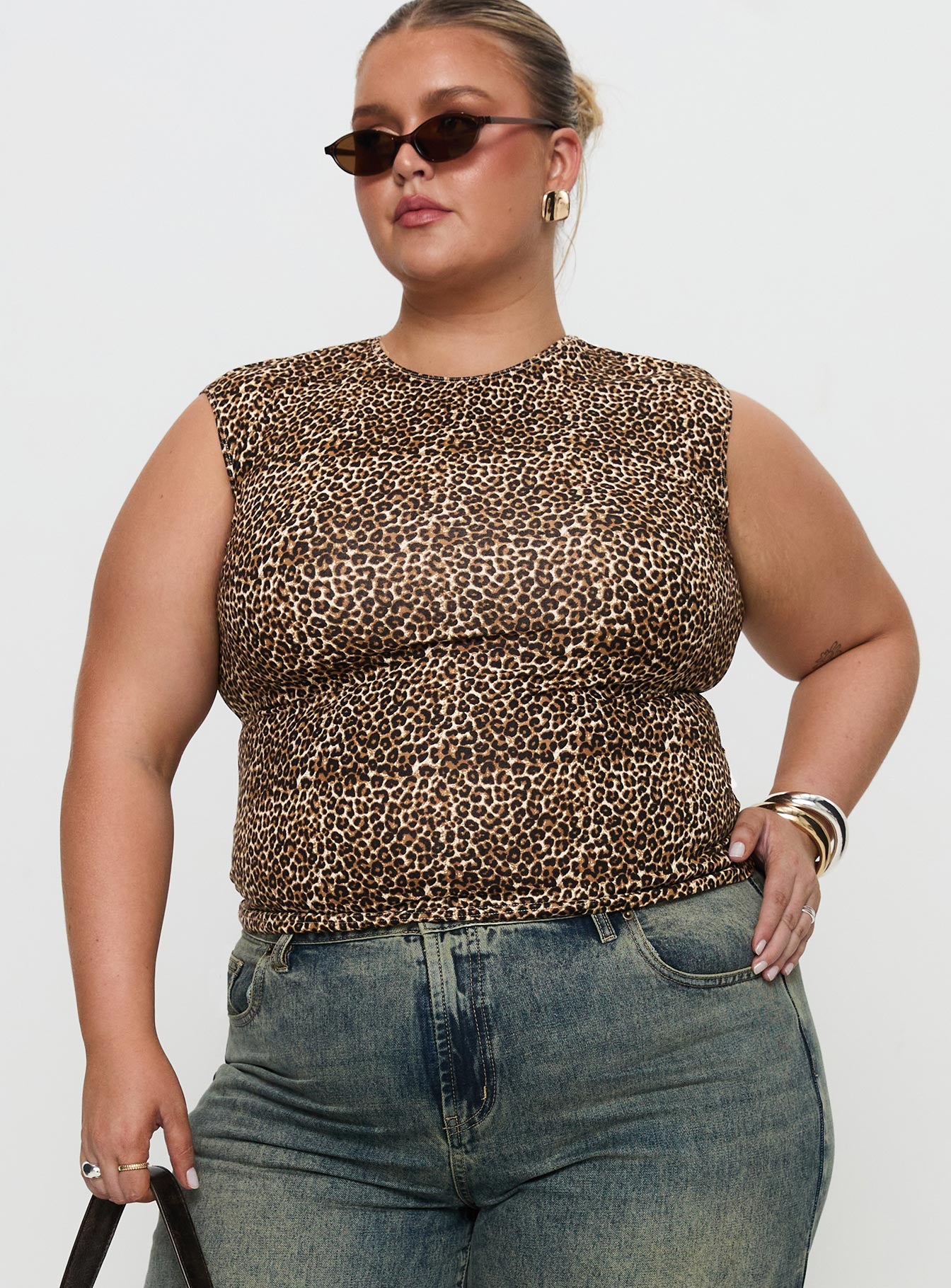 front view of model wearing Princess Polly Lure Top Leopard Curve Sleeveless Crew Neck 